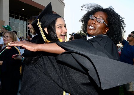 Lemoore College grads show off their diplomas to family and friends.